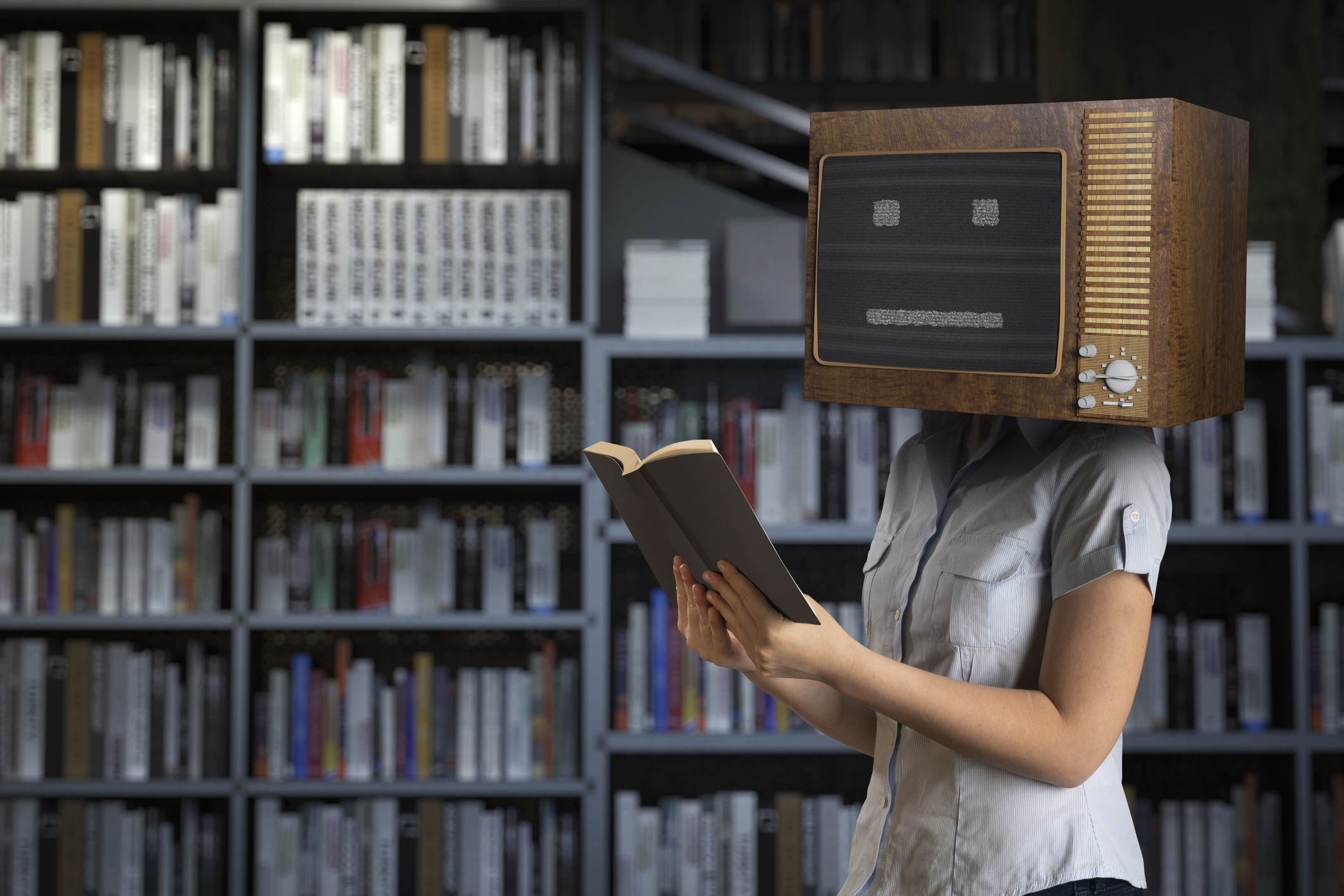 In a Library, A University Student with a TV on her head reads a book